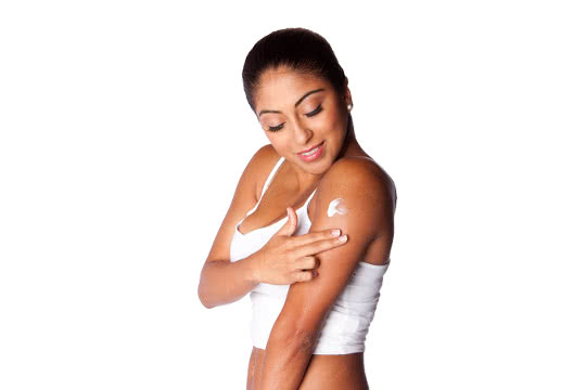 What is the best way to apply self-tanner evenly?