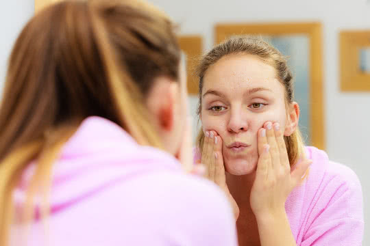 Woman using non-microbead scrub