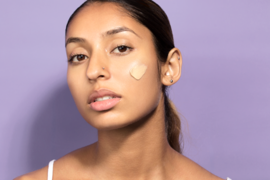 Sunscreen applied to woman's cheek