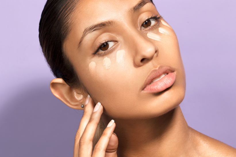 model wearing concealer swatches